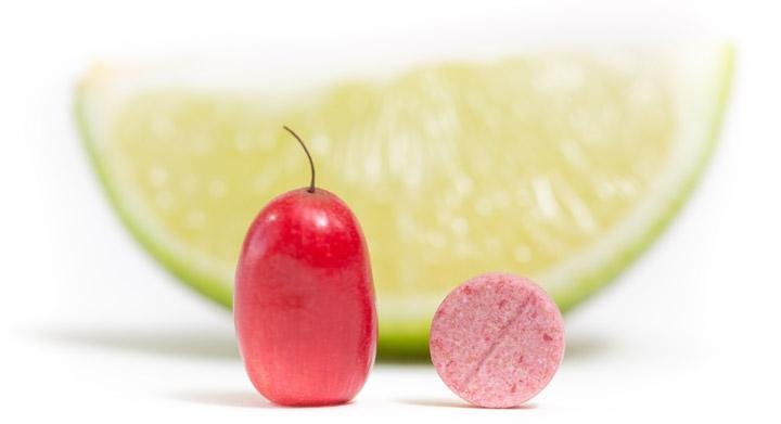 Miracle berry tablet next to a lime